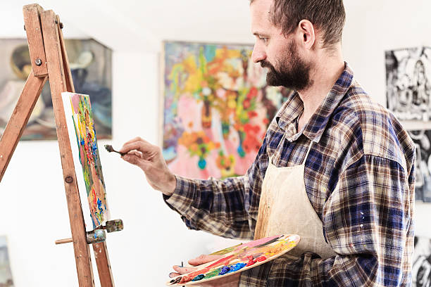 istock Artist with paint palette in his workshop 514320448