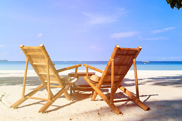 istock chairs of tropical sand beach 514320946