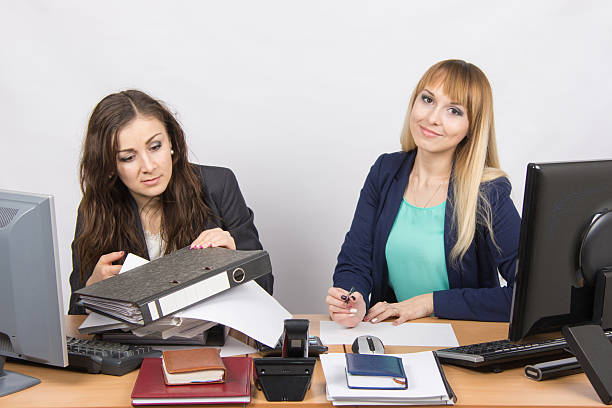 istock one employee can handle the job, the other is not 514321478
