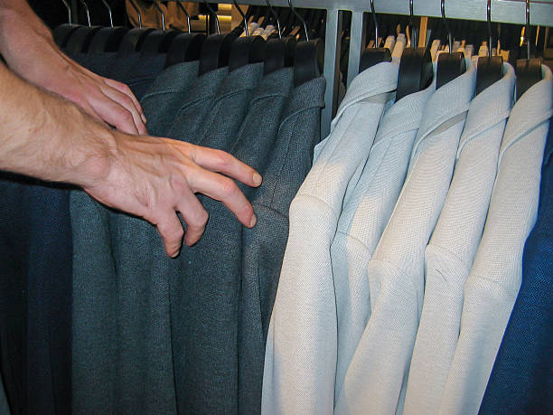 istock Adult male selecting blazer 514322292