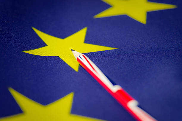 Macro image of a Union Flag pencil on one of the yellow stars, representing a member state on the EU Flag.