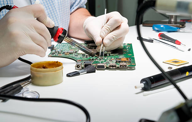 Soldering a computer board Soldering a computer board connection block computer cable electronics industry electricity stock pictures, royalty-free photos & images