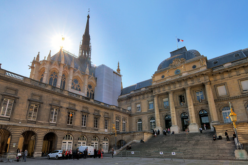 Paris, France - April 10, 2014: People visit the Palais de Justice (Palace of Justice) and the Sainte-Chapelle (Holy Chapel) in Paris, France, on April 10, 2014