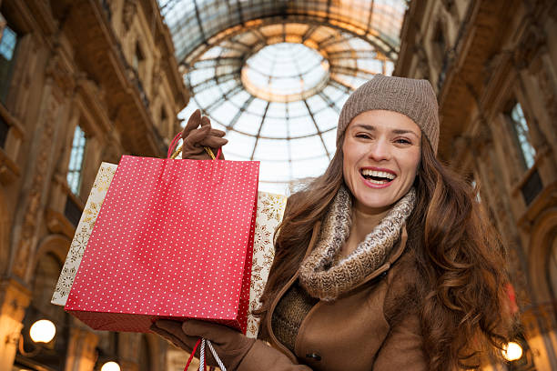 istock Woman showing shopping bags 514323570