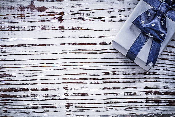 istock Packed present on vintage wooden board copyspace holidays concep 514324208