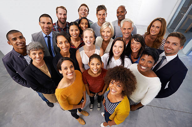 Teamwork makes the dream work High angle shot of a diverse group of business professionals organized group photos stock pictures, royalty-free photos & images