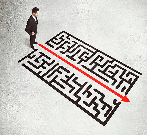 istock businessman looking on a labirinth 514325922