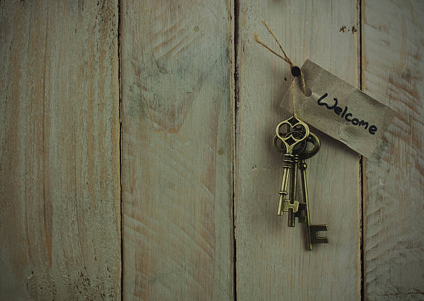 Antique keys on wooden background stock photo