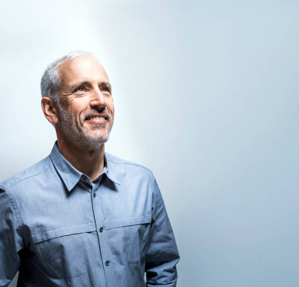 istock Ambitious businessman against blue background 514327482