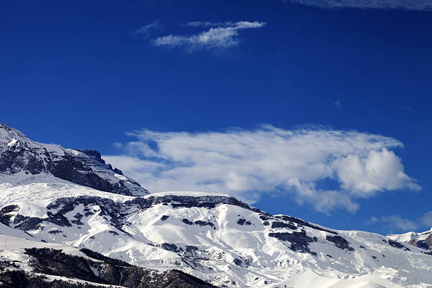istock Snowy rocks at nice sun day 514328834