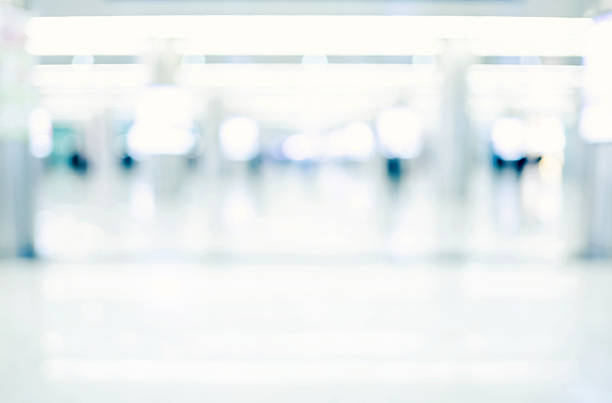 istock Blurred background, people in hallway business building 514329492