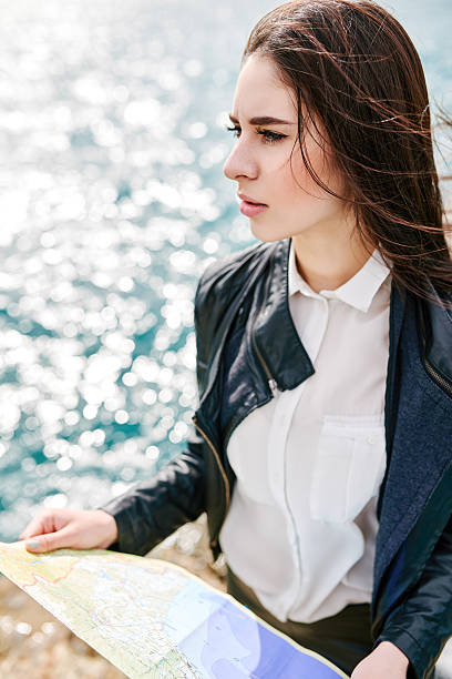 istock Woman on the pier watching map 514330506