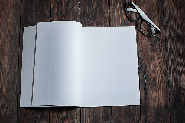 istock Photo blank. Open square format brochure on a wooden table 514331676