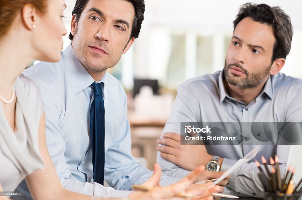 Business discussion Business people discussing together their strategy at office. Businesswoman talking about the future of corporate with others businessmen. Business meeting in office. Accountancy Stock Photo