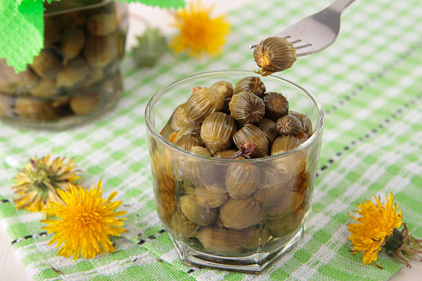 istock Fork with pickled flower buds of dandelions 514341431