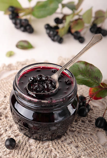 istock Spoon of black chokeberry jam 514342181