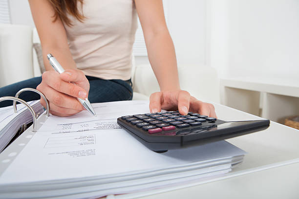 istock Woman Calculating Home Finances At Table 514342803