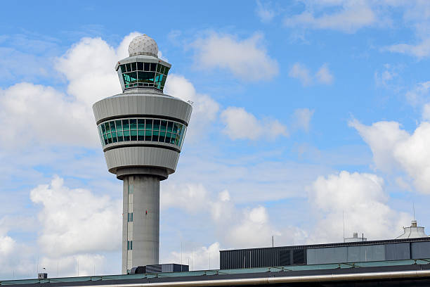 Air Traffic Control Tower Air traffic control tower at Schiphol Airport in The Netherlands. Amsterdam Airport Schiphol (AMS) is the main international airport of the Netherlands, and an international hub for several airline. It is one of the busiest airports in Europe. atc stock pictures, royalty-free photos & images