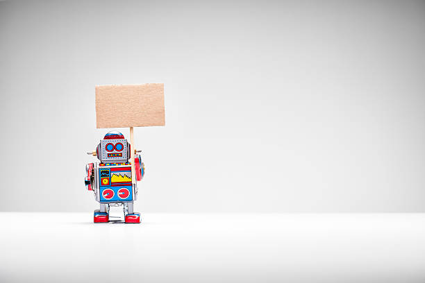 istock Retro tin toy robot holding up a sign 514342917