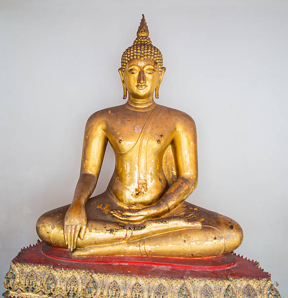 Buddha Statue And Row of Buddhas At Wat Phra Kaew stock photo