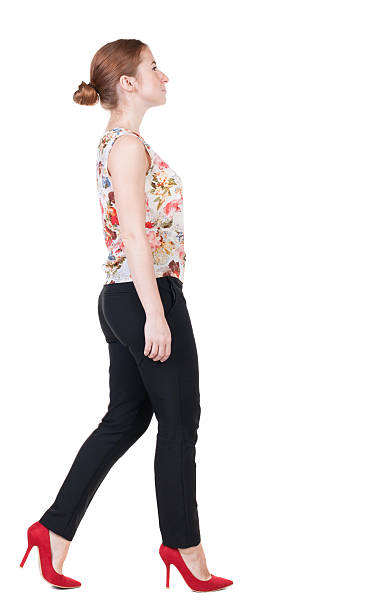 istock walking red head business woman. 514346065