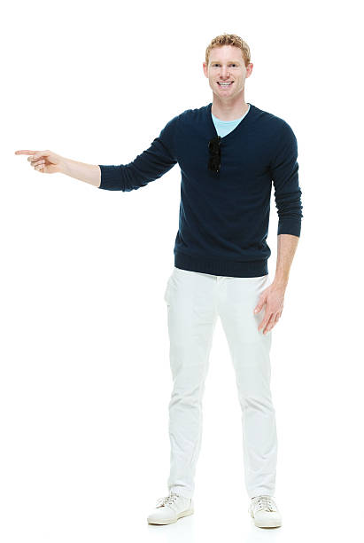 istock Smiling casual male pointing & looking at camera 514346491