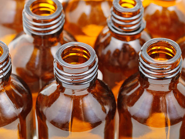 istock small open brown glass pharmacy bottles close up 514361709