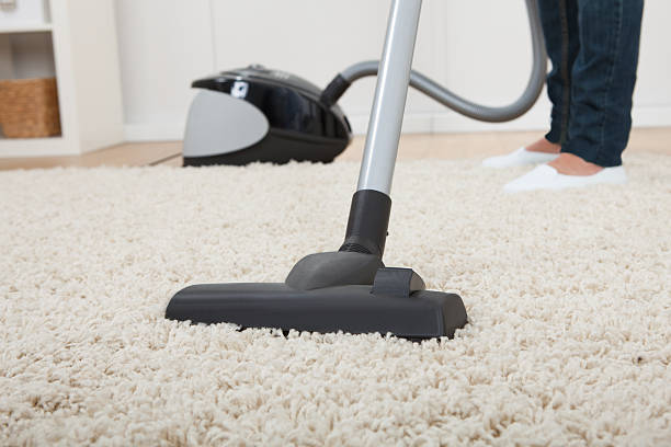 istock Low Section Of Woman Vacuuming Floor 514363763