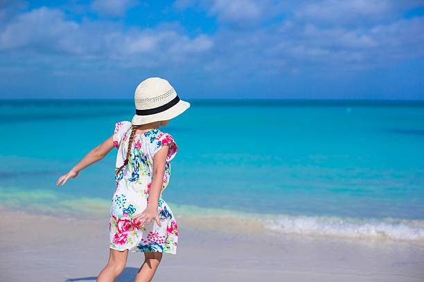 istock Adorable little girl at white beach during summer vacation 514364965