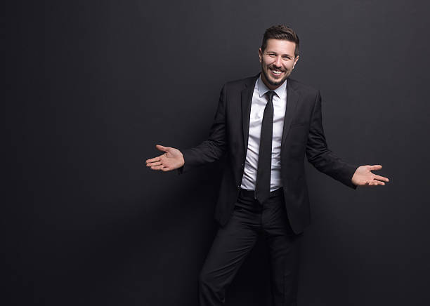 istock Young cheerful businessman with arms outstretched 514368360