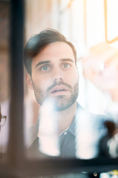 istock Concentrated businessman making plan on glass wall 514369814