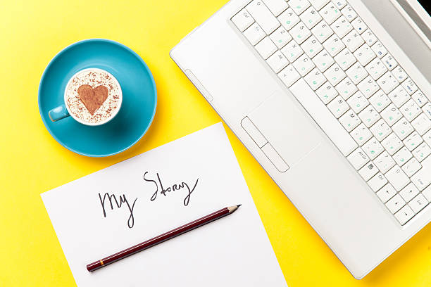 istock paper, pencil, laptop and cup lying on the table 514370150