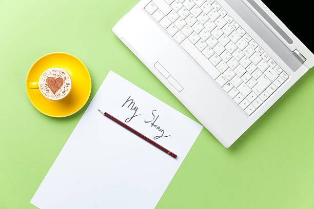istock paper, pencil, laptop and cup lying on the table 514370542