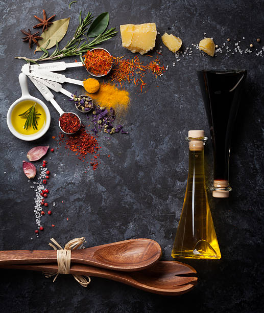 istock Herbs and spices over black stone 514371112