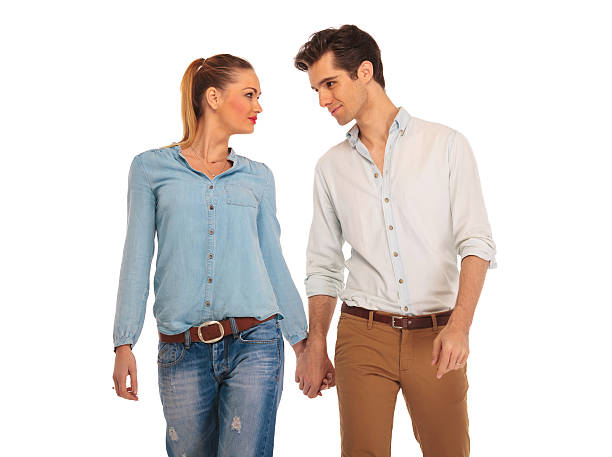 istock cute couple walking in white isolated studio 514371492