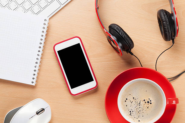 istock Office with notepad, coffee, smartphone and headphones 514373002