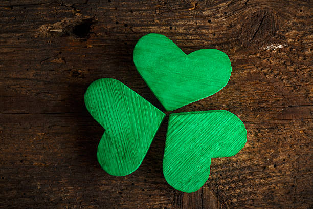 istock Green shamrock clovers on wooden background 514373480