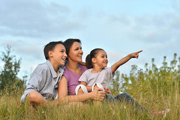 istock happy family at  green field 514374044
