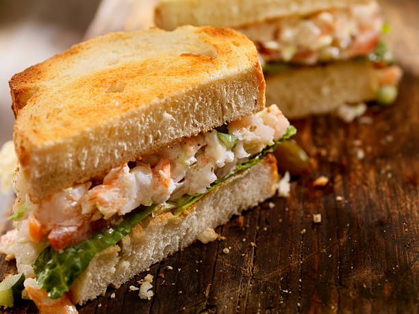 Toasted Seafood Salad Sandwich Toasted Seafood Salad Sandwich with Shrimp and Lobster-Photographed on Hasselblad H3D2-39mb Camera seafood salad stock pictures, royalty-free photos & images