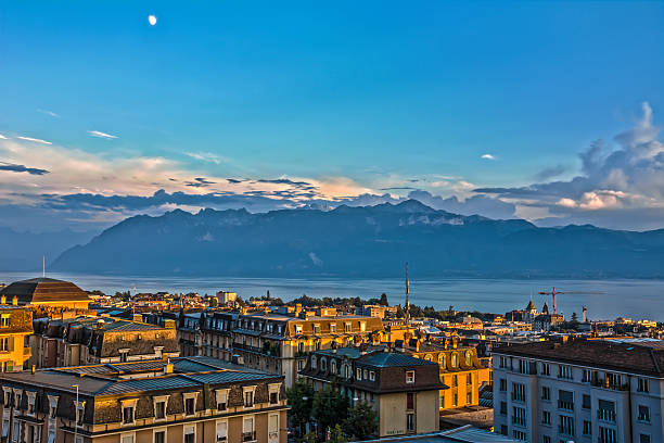 View over Lausanne at sunset, lake Geneva and Alps