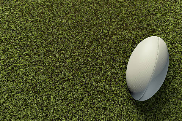 istock Rugby ball on grass pitch 514375274