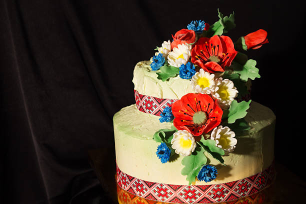 istock Ukrainian cake with sugar flowers on a black fabric  background 514376312