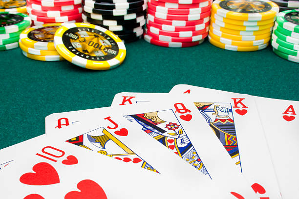 istock poker, royal flush and unfocused gambling chips 514378454
