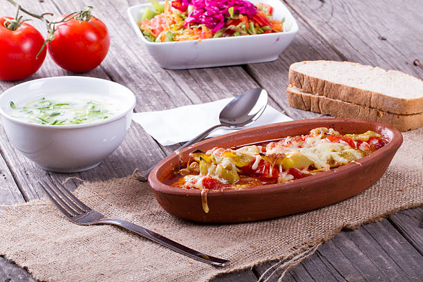 istock Chicken stew in oval stoneware crock served on wooden table 514379514