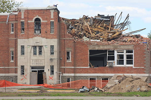 Tornado Damages Old Midwestern School This old school building in a tiny Midwestern town took a major hit from a tornado and sustained severe damage. broken spring stock pictures, royalty-free photos & images