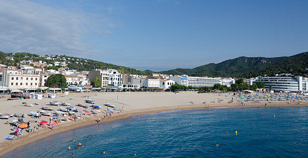 Busy morning on Playa Grande, Tossa-de-mar; Costa Brava, Spain Busy morning on Playa Grande, Tossa-de-mar; Costa Brava, Spain tossa de mar stock pictures, royalty-free photos & images