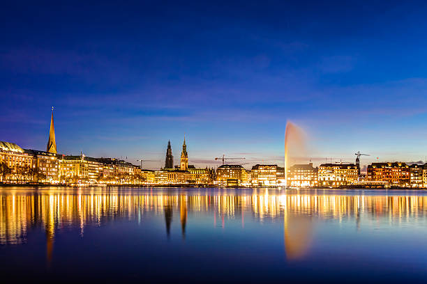 Hamburg town hall Hamburg Binnenalster and skyline during the twilight hour binnenalster lake stock pictures, royalty-free photos & images