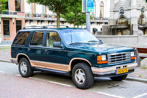 Rotterdam, Netherlands - August 9, 2014: Motor car Ford Explorer is parked in the city street.
