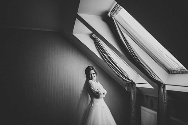 istock Luxury bride in white dress posing while preparing for the 514388966