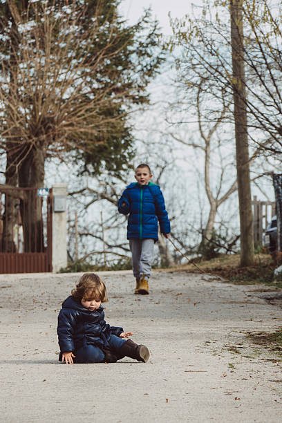 istock Baby fell on the ground, brother is running to help 514389788
